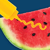 Watermelon with mustard squirted on it