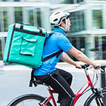 A food delivery driver on bike